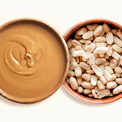 Peanut butter and peanuts in a plate