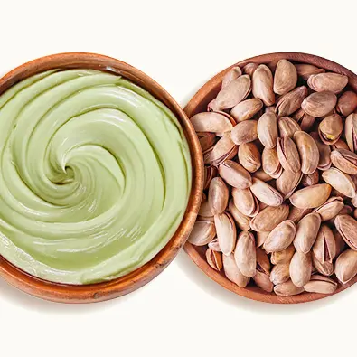 Pistachio spread with pistachios in a plate