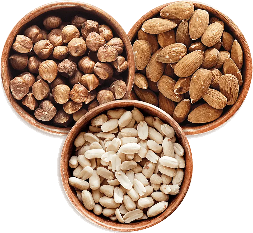 Bowls of peanuts, almonds and hazelnuts